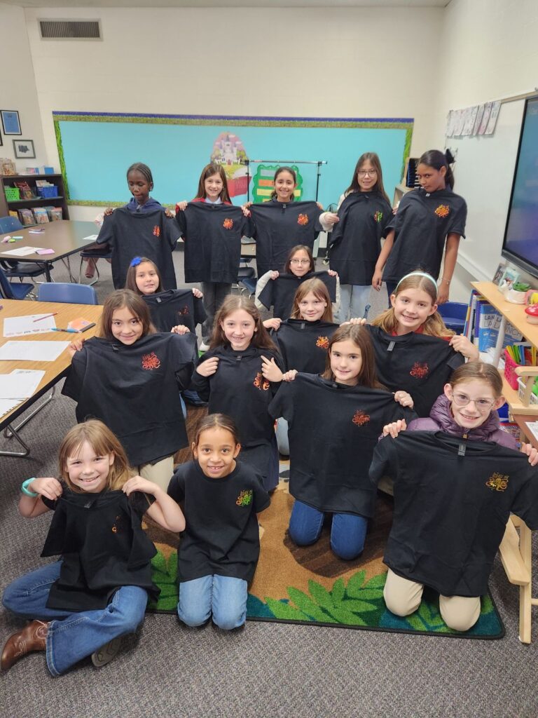 Seleger-Elementary-Writing-Club-Students-show-off-their-shirts-purchased-using-grant-funding-from-the-foundation